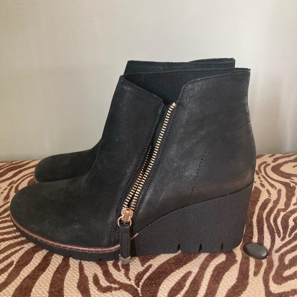 Never worn - Black ankle length bootie with platform heel and leather upper.